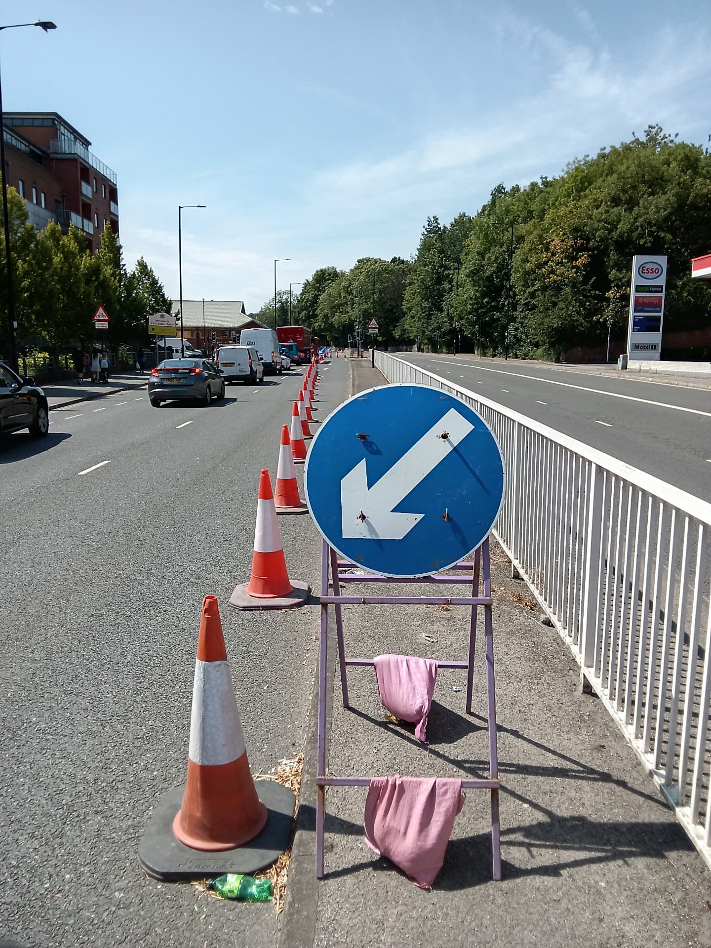 Coned lane closure with keep-left signage on a main road